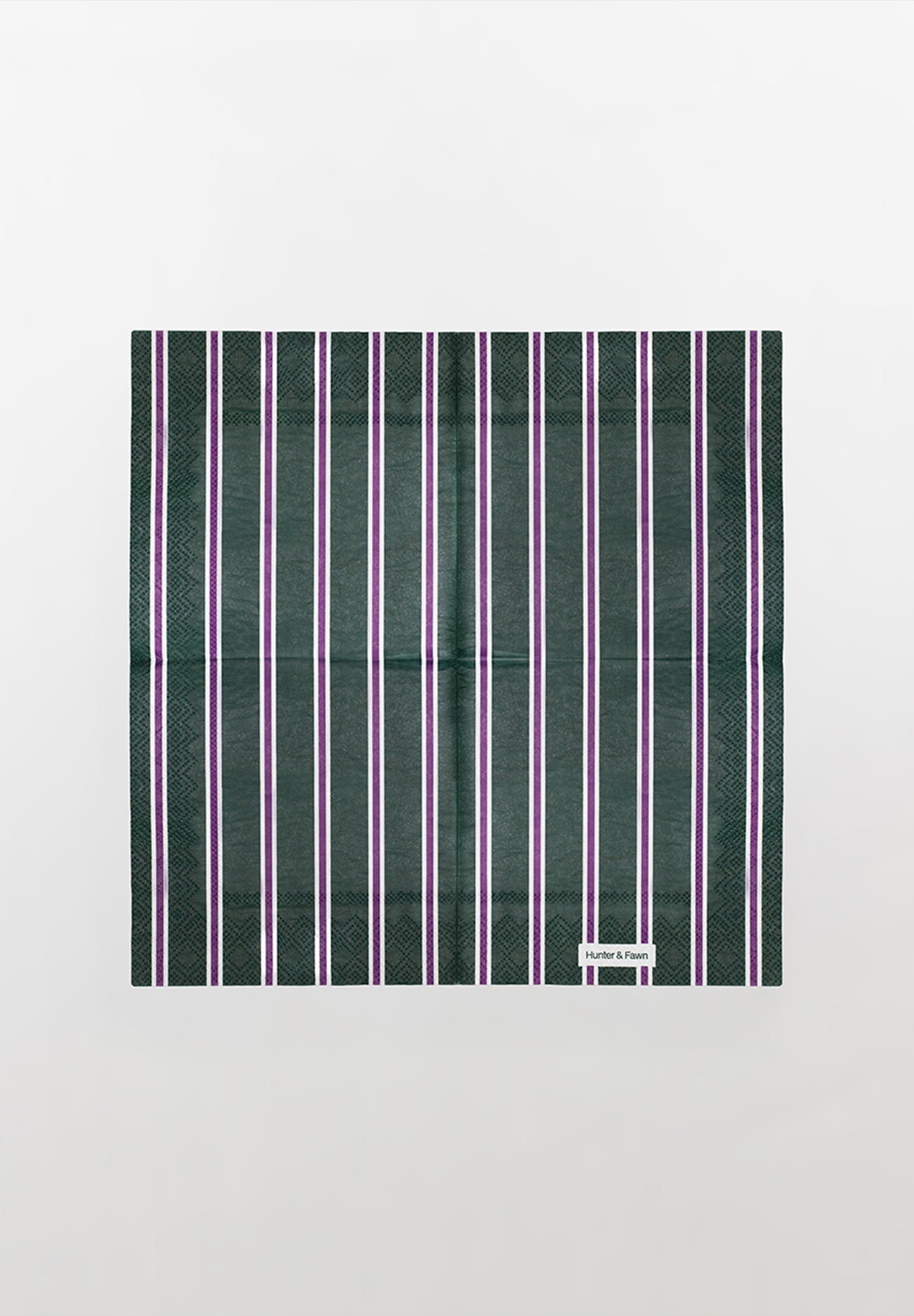 Detail of one-of-a-kind green and purple striped paper napkin — thoughtful design, not boring