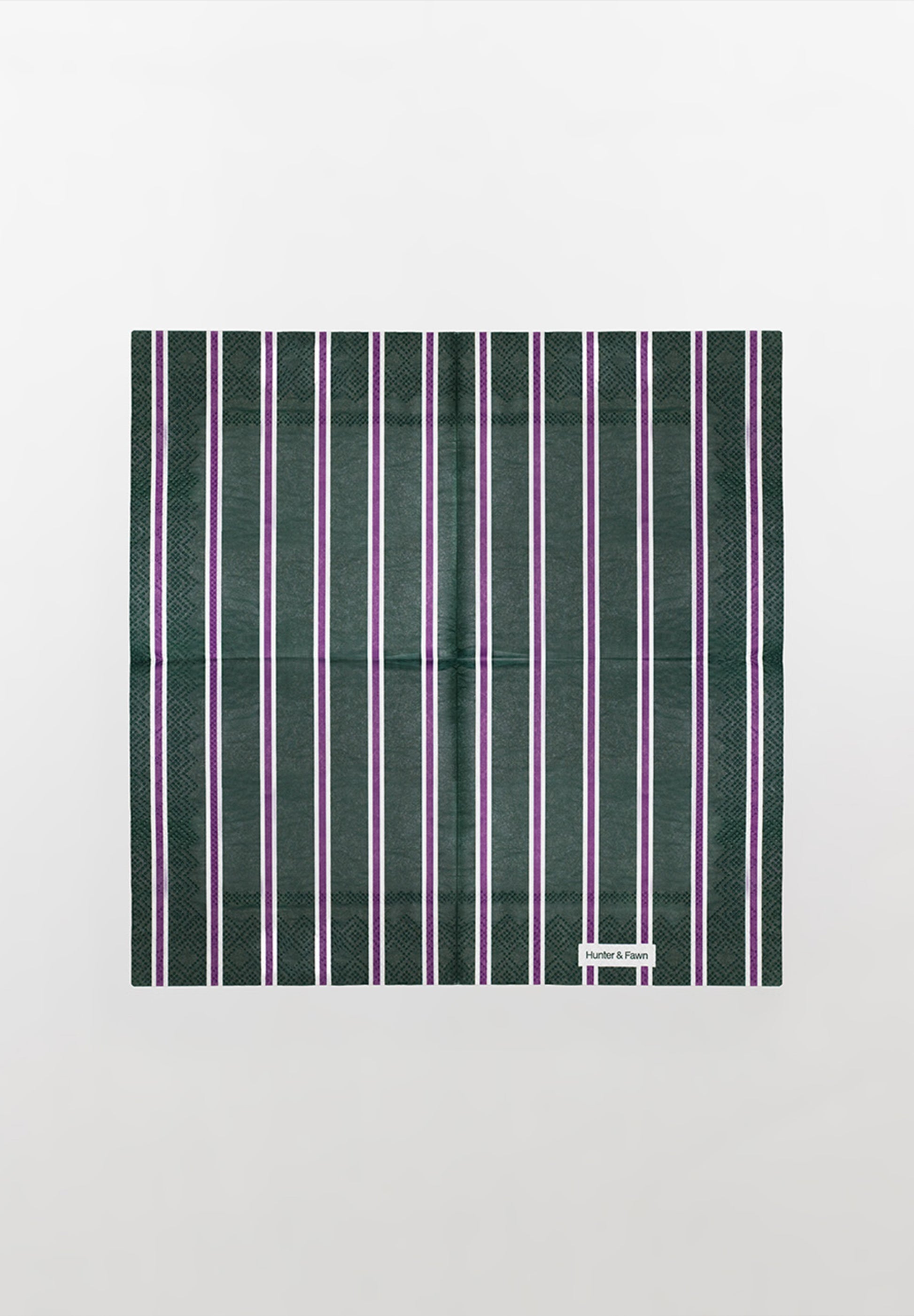 Detail of one-of-a-kind green and purple striped paper napkin — thoughtful design, not boring