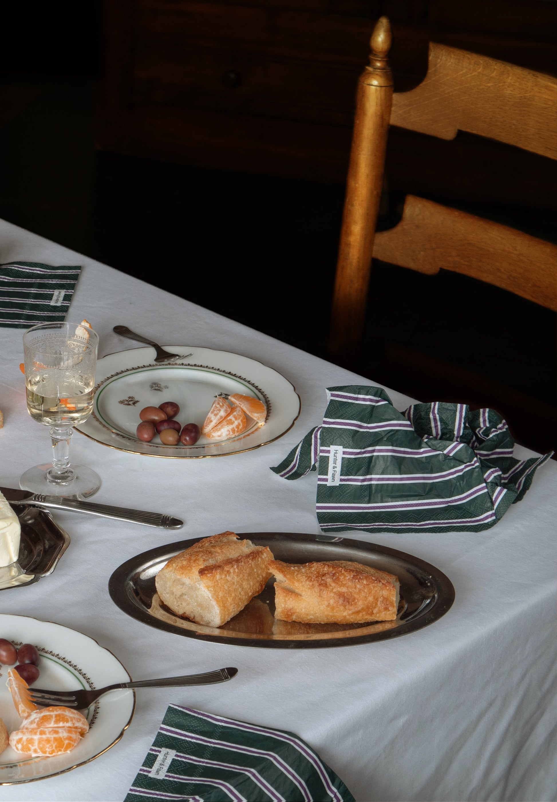 Unique disposable napkin in elevated dinner party scene — tasteful table styling with mood
